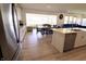 Spacious kitchen with island and view to the dining and living areas at 9640 Katana Cir, Fishers, IN 46040