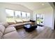 Bright living room with vaulted ceilings, lots of natural light, and modern furniture at 9640 Katana Cir, Fishers, IN 46040