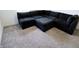 Large gray sectional sofa with plush carpet flooring, creating a cozy living space at 9640 Katana Cir, Fishers, IN 46040