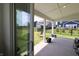 Inviting outdoor patio area with a view of the fenced backyard and neighboring houses at 9640 Katana Cir, Fishers, IN 46040