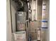 View of the interior components of a heater and water heater in a utility closet at 9640 Katana Cir, Fishers, IN 46040