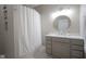 Bathroom featuring a vanity with a round mirror, and a shower with a curtain at 9743 Herons Cv, Carmel, IN 46280
