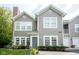 Charming two-story home with gray siding, manicured landscaping, and inviting entrance, creating excellent curb appeal at 9743 Herons Cv, Carmel, IN 46280