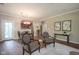 Open-concept living area with hardwood floors, a dining area, and views into the kitchen, great for gatherings at 9743 Herons Cv, Carmel, IN 46280