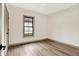 Bright bedroom has sleek laminate flooring, neutral paint and lots of natural light at 9811 Warren Pl, Indianapolis, IN 46229