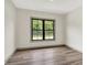 Bright bedroom has sleek laminate flooring, neutral paint and lots of natural light at 9811 Warren Pl, Indianapolis, IN 46229