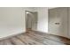 Bright bedroom has sleek laminate flooring and neutral paint at 9811 Warren Pl, Indianapolis, IN 46229