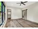Bright bedroom with hardwood floors, a ceiling fan and a walk in closet at 9811 Warren Pl, Indianapolis, IN 46229