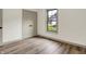 Bright bedroom has sleek laminate flooring, neutral paint and lots of natural light at 9811 Warren Pl, Indianapolis, IN 46229