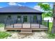 The exterior deck features black metal railing and overlooks the backyard at 9811 Warren Pl, Indianapolis, IN 46229