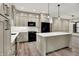 Modern kitchen with island, granite countertops, and stainless steel appliances, a culinary dream at 9811 Warren Pl, Indianapolis, IN 46229