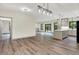 Expansive living space with hardwood floors, connecting kitchen and dining areas, great for entertaining at 9811 Warren Pl, Indianapolis, IN 46229