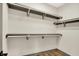 Bright walk-in closet with multiple shelves and railing provides ample storage space at 9811 Warren Pl, Indianapolis, IN 46229