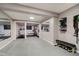 Basement gym area with mirrored walls, exercise equipment, and ample workout space at 10243 Brixton Ln, Fishers, IN 46037