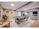 Spacious basement with a pool table, dart board, and room for entertaining at 10243 Brixton Ln, Fishers, IN 46037