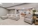 Basement living area with sectional sofa, and a view into the game room with a pool table at 10243 Brixton Ln, Fishers, IN 46037