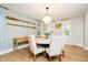 Inviting dining room with chandelier, hardwood floors, and soft natural light at 10243 Brixton Ln, Fishers, IN 46037