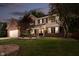 Charming two-story home with a brick and siding exterior, lush lawn, and an American flag at 10243 Brixton Ln, Fishers, IN 46037