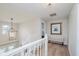 Upstairs hallway leads to bedrooms at 10243 Brixton Ln, Fishers, IN 46037