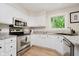 Well-equipped kitchen features granite counters and stainless appliances at 10243 Brixton Ln, Fishers, IN 46037