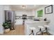 Bright kitchen with white cabinets and stainless steel appliances at 10243 Brixton Ln, Fishers, IN 46037