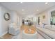 Open-concept living space with hardwood floors connects to kitchen area at 10243 Brixton Ln, Fishers, IN 46037