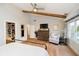 A light-filled main bedroom features hardwood floors, a vaulted ceiling, and a walk-in closet at 10243 Brixton Ln, Fishers, IN 46037