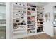 Organized walk-in closet features custom shelving, storage for shoes, bags, and accessories at 10243 Brixton Ln, Fishers, IN 46037