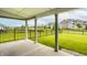 Covered back porch overlooking fenced yard, perfect for outdoor relaxation and entertainment at 10922 Liberation Trce, Noblesville, IN 46060