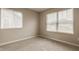 Bright bedroom featuring two windows with blinds and neutral carpet at 10922 Liberation Trce, Noblesville, IN 46060