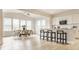 Bright kitchen and dining area with white cabinets, modern appliances, and ample seating at 10922 Liberation Trce, Noblesville, IN 46060