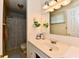 Standard bathroom features a tub and shower combo and traditional vanity at 1102 Fox Hill Dr, Indianapolis, IN 46228