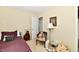 Bedroom with hardwood floors, lamp and chair at 1102 Fox Hill Dr, Indianapolis, IN 46228