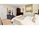Cozy bedroom with a large bed, wooden dresser, and closet, designed for relaxation and rest at 1102 Fox Hill Dr, Indianapolis, IN 46228