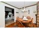 Cozy dining area with a round table, wooden chairs, and decorative wallpaper border, creating a warm and inviting space at 1102 Fox Hill Dr, Indianapolis, IN 46228