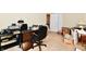 Home office featuring a large desk, office chair, shelving, and natural light, conducive to productivity at 1102 Fox Hill Dr, Indianapolis, IN 46228
