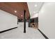 Modern basement area featuring a sauna, tiled floors, a jacuzzi, and wooden accents at 11101 Hawthorn Rdg, Fishers, IN 46037