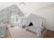 Charming bedroom with unique wallpaper, canopy beds, and ample natural light at 11101 Hawthorn Rdg, Fishers, IN 46037