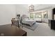 Comfortable bedroom with carpet flooring, natural light, sitting area and large decorative light fixture at 11101 Hawthorn Rdg, Fishers, IN 46037