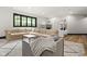 Spacious bedroom featuring a large sectional couch, a window, and two white bunk beds at 11101 Hawthorn Rdg, Fishers, IN 46037