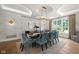 Elegant dining room with a chandelier, large windows, and luxurious finishes, perfect for hosting gatherings at 11101 Hawthorn Rdg, Fishers, IN 46037