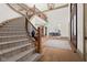 Spacious foyer with staircase, hardwood floors, and elegant decor at 11101 Hawthorn Rdg, Fishers, IN 46037