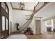 Stunning foyer with grand staircase, high ceilings, and decorative lighting at 11101 Hawthorn Rdg, Fishers, IN 46037