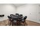 Room with a poker table surrounded by chairs, hardwood floors, and a white door at 11101 Hawthorn Rdg, Fishers, IN 46037