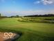 Beautiful view of a golf course with a water hazard and well-maintained green at 11101 Hawthorn Rdg, Fishers, IN 46037