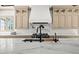 Well-appointed kitchen featuring a large center island with a marble countertop and custom cabinetry at 11101 Hawthorn Rdg, Fishers, IN 46037