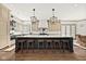 Bright kitchen with a center island, pendant lighting, herringbone backsplash, and ample counter space, perfect for cooking at 11101 Hawthorn Rdg, Fishers, IN 46037