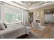 Open-concept layout offering a seamless transition from the main bedroom to a cozy sitting area at 11101 Hawthorn Rdg, Fishers, IN 46037