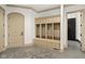Organized mudroom features built-in storage cubbies, neutral tones, and easy access to the home at 11101 Hawthorn Rdg, Fishers, IN 46037