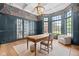Office space with light wood floors, a writing desk, floral wallpaper, and large windows at 11101 Hawthorn Rdg, Fishers, IN 46037